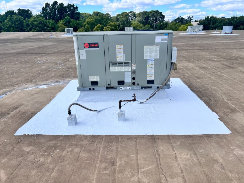 Commercial flat roof leak repair around HVAC equipment